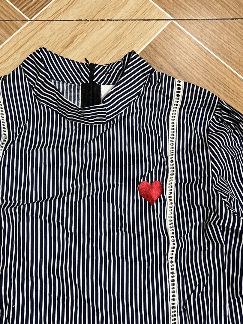 Striped Blouse with Heart Detail (Category: Blouses) located in Baguio. Submitted by izzy1234123 (Listing ID 1438356969, Image 2). Description: - Black and white striped pattern - High neckline - Long sleeves - Side tie detail - Embroidered red heart - Peplum hemline - Back zipper closure.