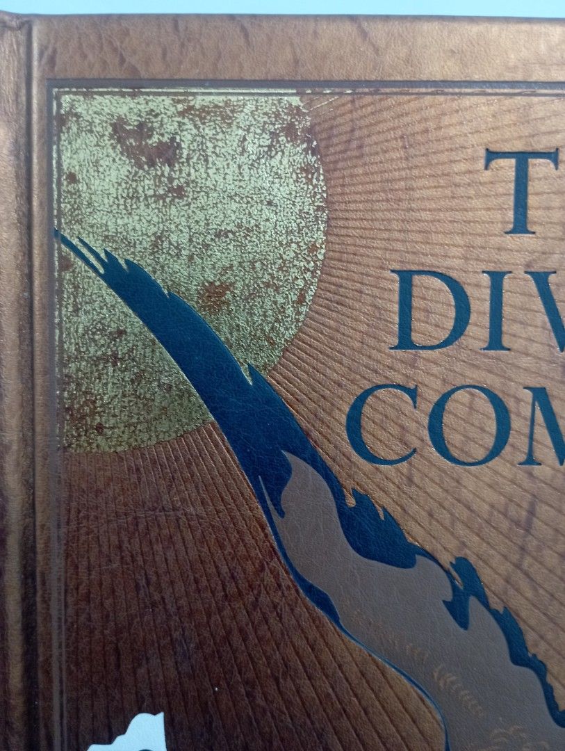 The Divine Comedy by Dante Alighieri (Category: Storybooks) located in Las Pinas. Submitted by luke.the6th (Listing ID 1438317544, Image 2). Description: - The Divine Comedy by Dante Alighieri - English text - Copper-colored cover - Features a bird illustration - Includes decorative endpapers - Contains internal illustrations - White pages.