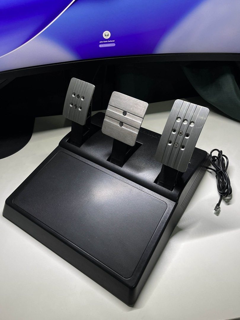 Thrustmaster T300RS GT Edition (Category: Controllers) located in Manila. Submitted by eunixverse (Listing ID 1438313202, Image 2). Description: - Thrustmaster T300RS GT racing wheel - Compatible with PS5 and PS4 - Includes: - Wheel with integrated buttons and paddle shifters - Pedal set (three pedals) - Power adapter - Original box - Includes receipt and complete packaging - Bought on June 29, 2024 from DataBlitz. RFS: Di na nagagamit..