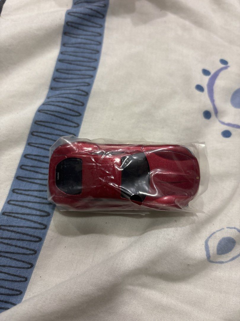 Tomica Ferrari Roma Scale 1/62 (Category: Vehicle & Diecast Models) located in Manila. Submitted by colin92421 (Listing ID 1438476950, Image 2). Description: - Tomica Ferrari Roma diecast model - Color: Red - Scale: 1/62 - Original packaging included - Car is still sealed - Features the Tomica logo and car details on the box.