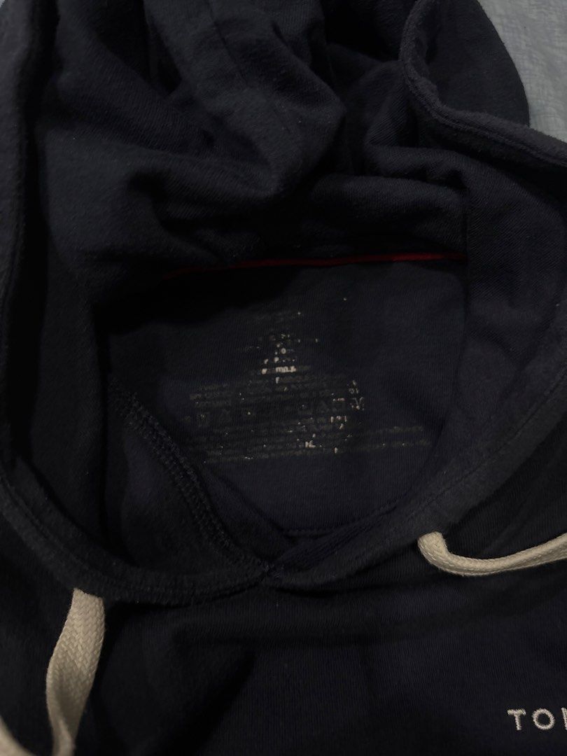 Tommy Hilfiger Hoodie (Category: Hoodies) located in Manila. Submitted by colin92421 (Listing ID 1438472782, Image 3). Description: - Navy blue Tommy Hilfiger hoodie - Features a hood with drawstring - White and red stripes on the sleeves - Tommy Hilfiger logo on the chest - Ribbed hem and cuffs - Plain navy blue back - Authentic Tommy Hilfiger (see tag).