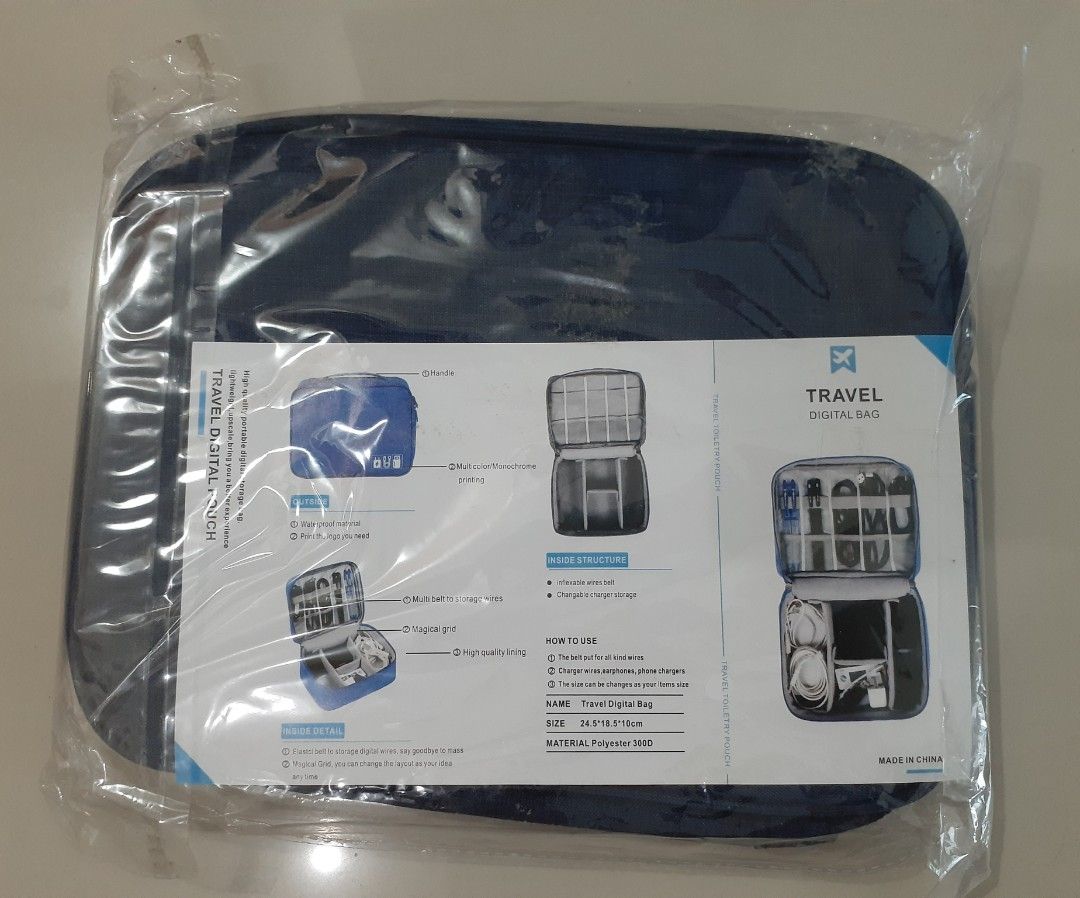 Travel Digital pouch (Category: Luxury Bags & Wallets) located in Manila. Submitted by comercio (Listing ID 1438362059, Image 2). Description: - Travel digital bag for tech essentials - Features multiple compartments for cables, chargers, and accessories - Blue color - Includes a handle for easy carrying - Keeps electronics safe and organized - Made of durable material.