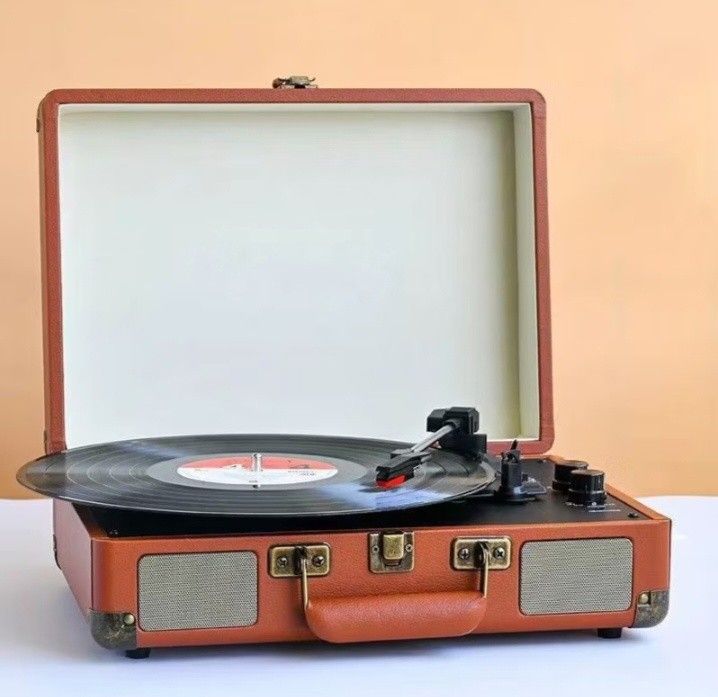 Turntable vinyl record (Category: Portable Music Players) located in Makati City. Submitted by owlthriftstore (Listing ID 1438494156, Image 2). Description: Available Black, brown, white, blue, red-black.