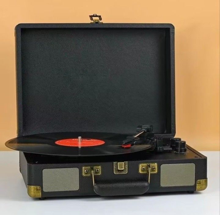 Turntable vinyl record (Category: Portable Music Players) located in Makati City. Submitted by owlthriftstore (Listing ID 1438494156, Image 3). Description: Available Black, brown, white, blue, red-black.