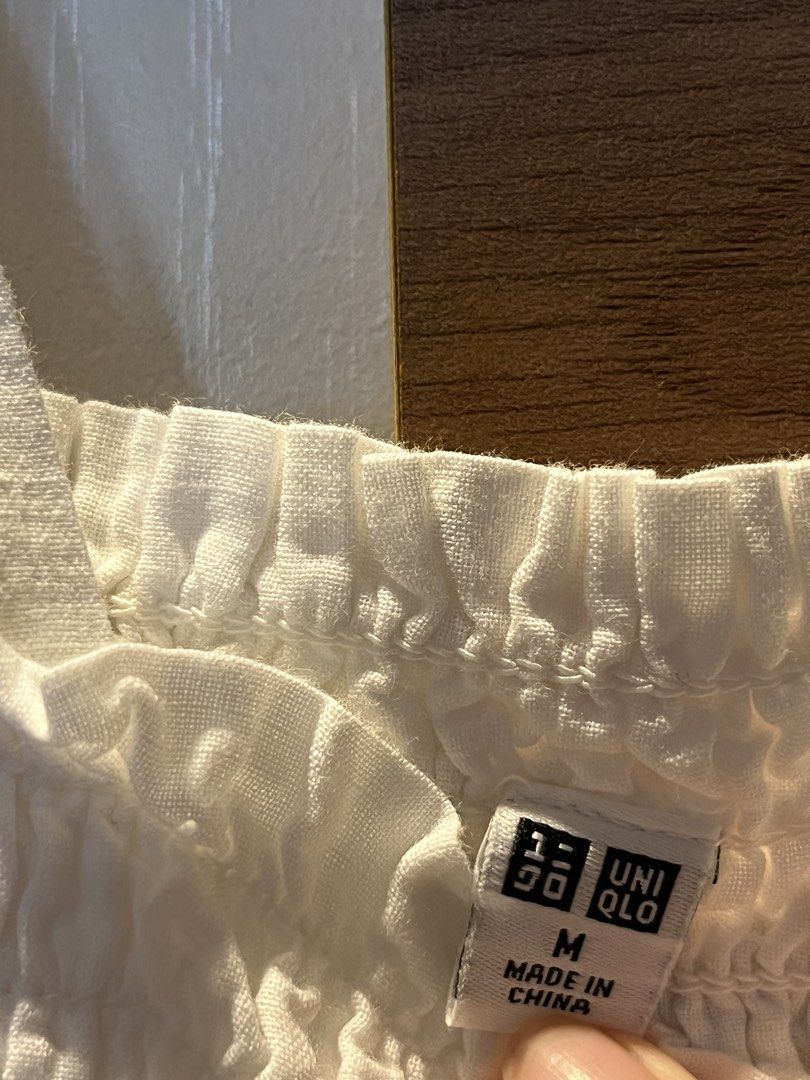 [SOLD] Uniqlo white smocked ruffled top (Category: Sleeveless) located in Manila. Submitted by shopthevintage (Listing ID 1438355184, Image 2). Description: pm for more details.