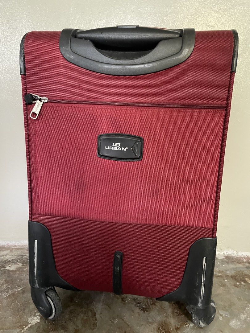 Urban Luggage Maroon Suitcase (Category: Luggage) located in Santa Rosa. Submitted by emelyn71 (Listing ID 1438383111, Image 3). Description: - Maroon Urban luggage - Multiple compartments - TSA lock for security - Retractable handle and wheels for easy transport - Interior straps to secure belongings - Front pocket for quick access - Top handle for carrying - Patterned interior lining - Visible zippers.