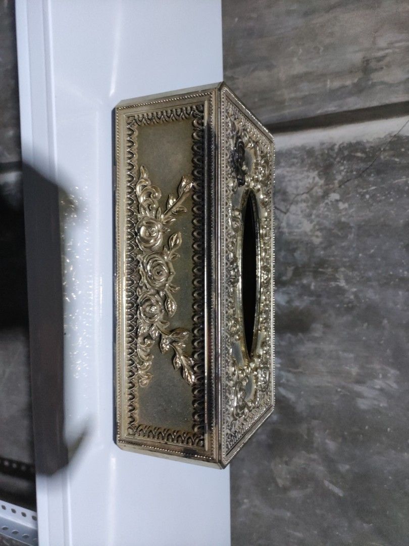 Vintage Floral Tissue Box (Category: Storage Boxes & Baskets) located in Batangas. Submitted by alcorner (Listing ID 1438424961, Image 1). Description: - Vintage tissue box - Floral design - Rectangular shape - Embossed details - Gold/brass tone - Removable base for easy tissue replacement - Oval tissue dispensing opening.