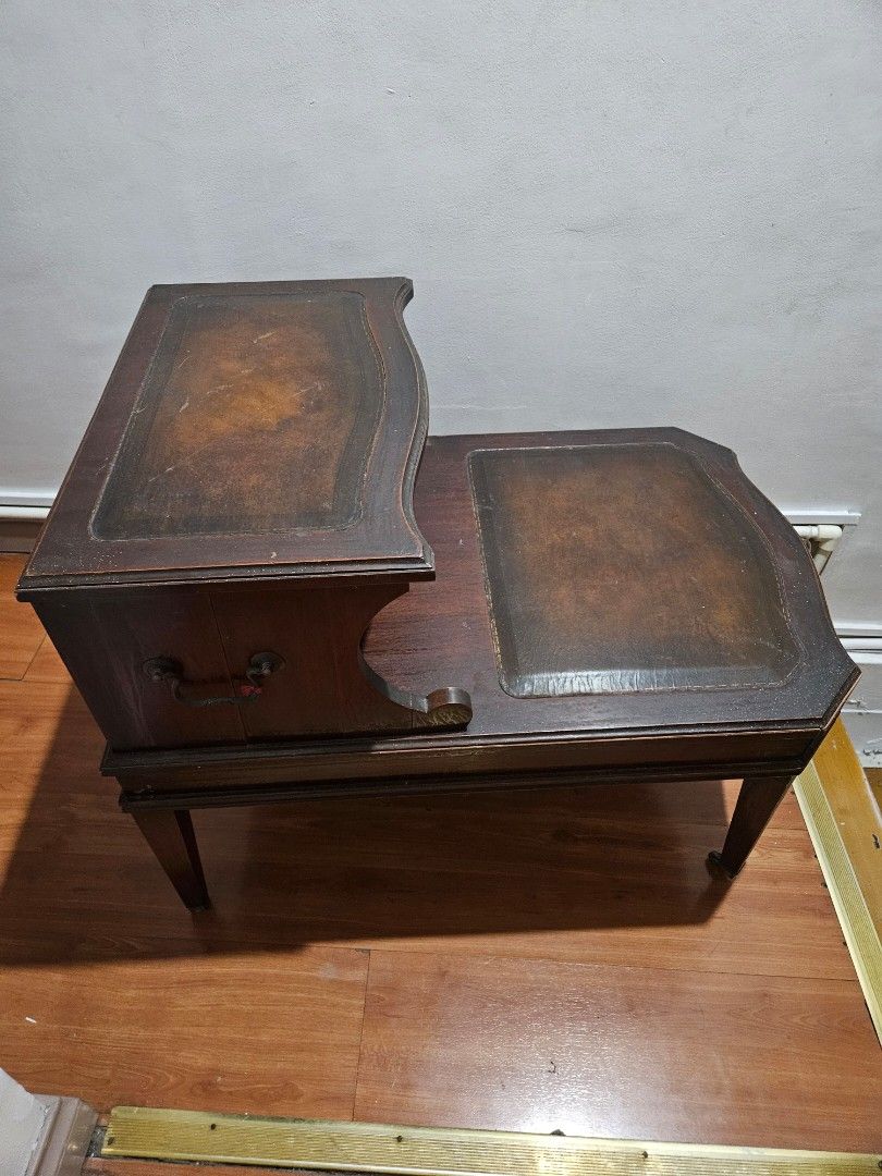 Vintage Wooden Side Table with Drawer (Category: Tables & Sets) located in Caloocan City. Submitted by rm.diaz (Listing ID 1438436900, Image 3). Description: - Vintage side table - Features a drawer with metal handle - Dark wooden finish - Decorative edges - Sturdy and functional - Stylish design.