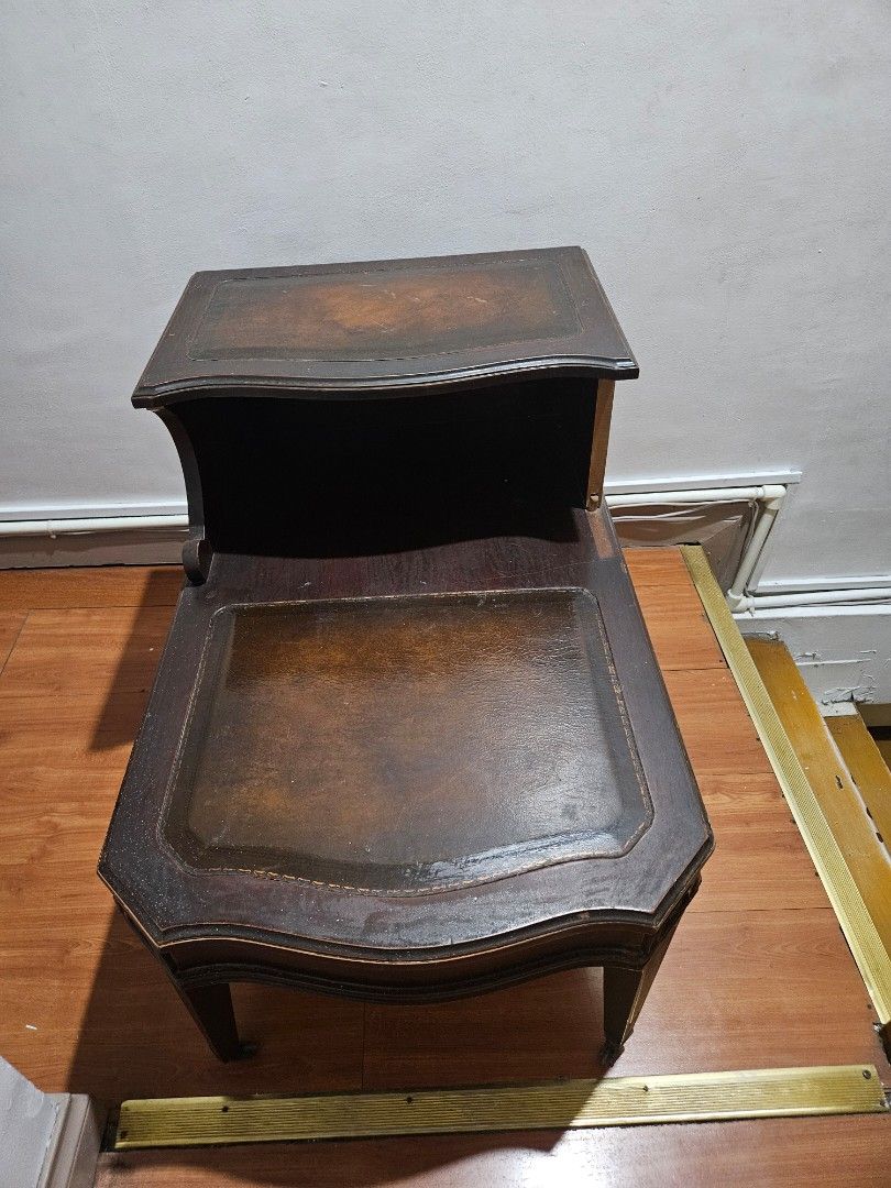 Vintage Wooden Side Table with Drawer (Category: Tables & Sets) located in Caloocan City. Submitted by rm.diaz (Listing ID 1438436900, Image 2). Description: - Vintage side table - Features a drawer with metal handle - Dark wooden finish - Decorative edges - Sturdy and functional - Stylish design.