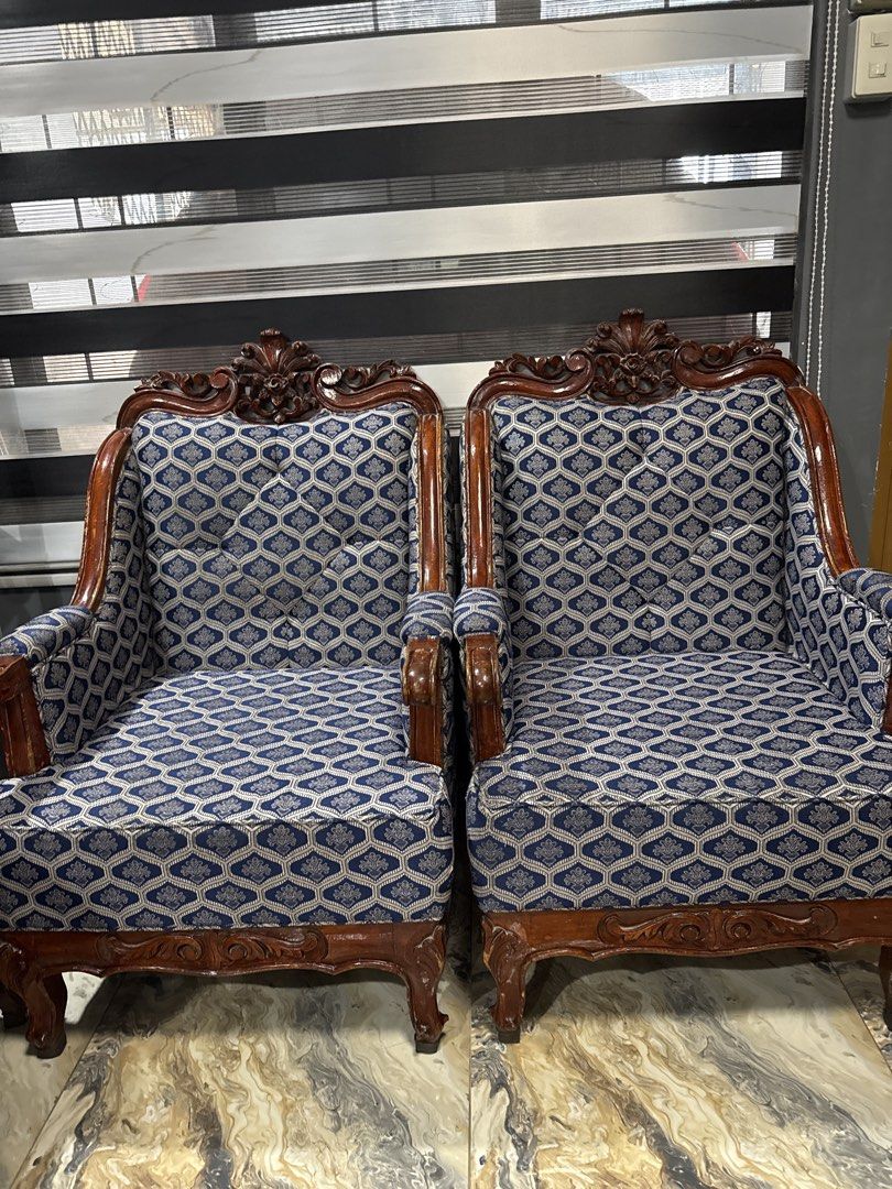 Vintage Wooden Sofa with Patterned Upholstery (Category: Sofas) located in Manila. Submitted by letsirkrom34542 (Listing ID 1438387568, Image 3). Description: - Vintage sofa - Intricate wooden detailing - Patterned upholstery - Classic design - Comfortable seating - Adds vintage charm Selling one set of wooden with foam sofa color blue, design as per picture. Wet and dry cleaning at foam and re-varnish of wooden part done last month. Sophisticate
