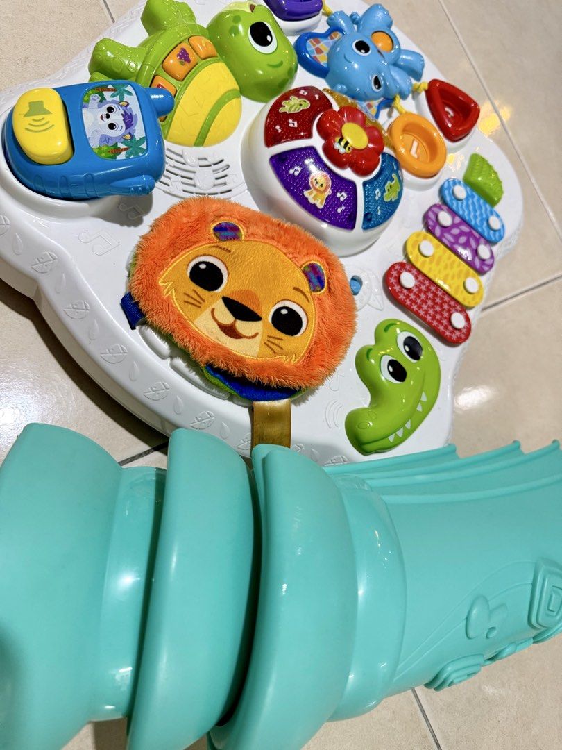 VTech Touch & Explore Activity Table (Category: Infant Playtime) located in Petaling Jaya. Submitted by ywwwe (Listing ID 1438415124, Image 3). Description: - VTech Touch & Explore Activity Table - Interactive features: animal figures, number buttons, xylophone - Detachable slide included - Musical component - Bright, engaging colors - Includes a hanging toy - Designed for toddlers' entertainment and education.