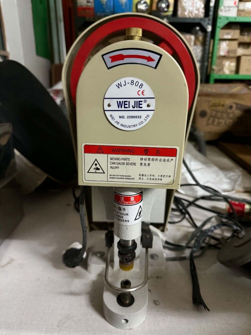 WJ-808 Eyelet Machine (Category: Industrial Equipment) located in Manila. Submitted by bebekikest39865 (Listing ID 1438480757, Image 1). Description: - WJ-808 eyelet machine - Good working condition - Red and beige color scheme - Industrial-grade design - Suitable for eyelet applications - Warning label for moving parts.