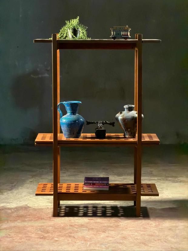 Wooden Display Shelf (Category: Shelves, Cabinets & Racks) located in Valenzuela. Submitted by upcycle_things (Listing ID 1438377889, Image 1). Description: - 3-tier wooden display shelf - Unique square-cut shelf design - Ideal for decorative items, books, and plants - Warm wood tone for a sophisticated look - Sturdy and stable construction - Stylish home decor addition.