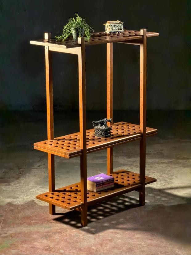 Wooden Display Shelf (Category: Shelves, Cabinets & Racks) located in Valenzuela. Submitted by upcycle_things (Listing ID 1438377889, Image 3). Description: - 3-tier wooden display shelf - Unique square-cut shelf design - Ideal for decorative items, books, and plants - Warm wood tone for a sophisticated look - Sturdy and stable construction - Stylish home decor addition.