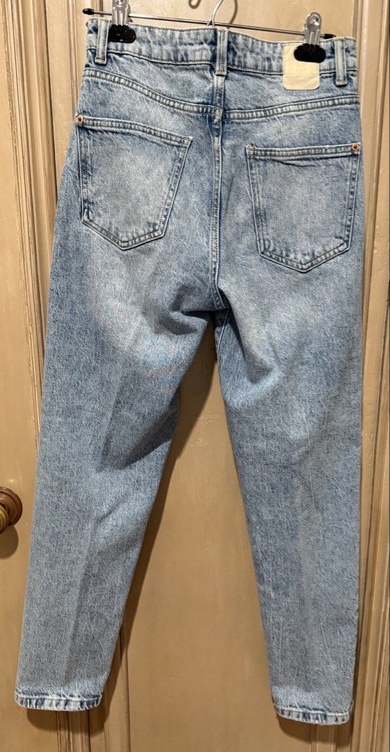 Zara Denim Jeans-Mom Jeans (Category: Jeans) located in Quezon City. Submitted by d.othersetc (Listing ID 1438403463, Image 2). Description: Zara high-waisted denim jeans feature a light wash with a slightly distressed or “acid wash” finish. They are identified as Mom Jeans, a popular Zara silhouette known for a high rise and slightly relaxed fit through the legs..
