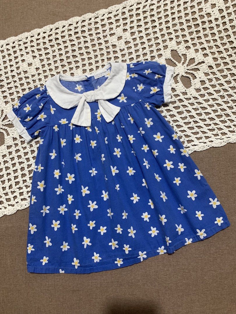 18M Blue Daisy Print Dress (Category: Babies & Kids Fashion) located in Davao. Submitted by _declutterwithme30 (Listing ID 1438563137, Image 1). Description: - Adorable blue dress - Charming daisy print - White Peter Pan collar and cuffs - Bow detail at neckline - Lightweight fabric - Short, puffed sleeves - Perfect for warm weather.