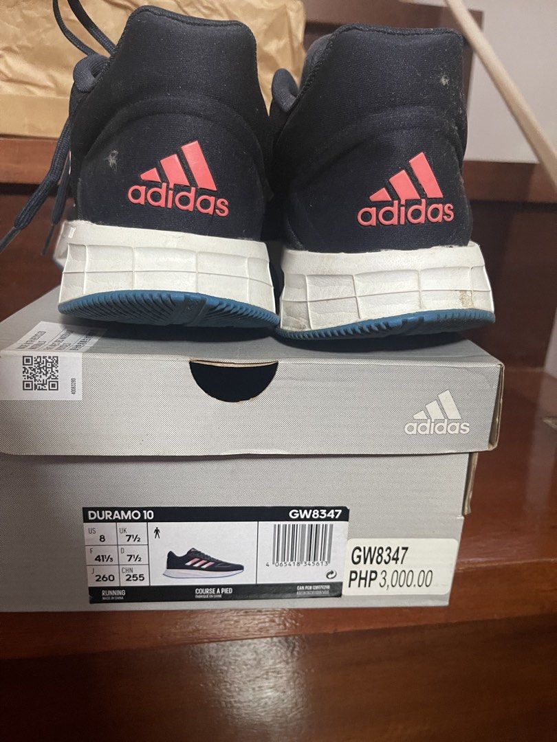 Adidas Duramo 10 Running Shoes (Category: Sneakers) located in Manila. Submitted by rizver2026 (Listing ID 1438606312, Image 2). Description: - Adidas Duramo 10 running shoes - Color: Navy blue with pink accents - Blue sole, white midsole - Size: US 8 / UK 7.5 - Includes original box - Model number: GW8347 - Original price: PHP 3,000.