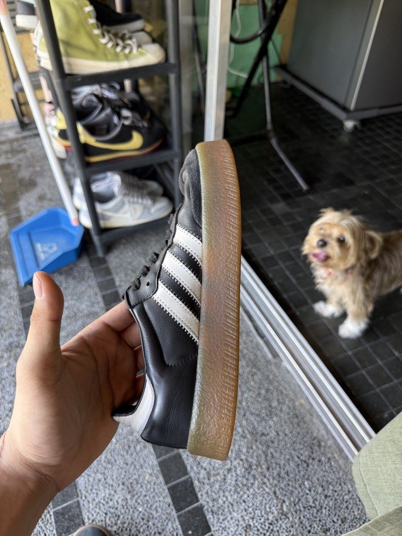 Adidas Samba Black White Gum Sole (Category: Sneakers) located in Paranaque City. Submitted by ffeeeej (Listing ID 1438662630, Image 3). Description: - Adidas Samba sneakers - Black with white stripes - Classic gum sole - Features "SAMBA" text on the side - Soles show some wear.