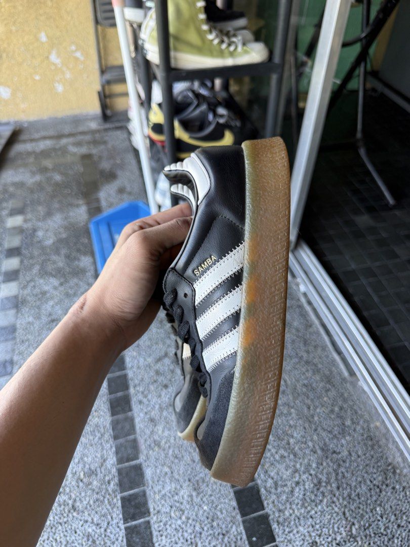 Adidas Samba Black White Gum Sole (Category: Sneakers) located in Paranaque City. Submitted by ffeeeej (Listing ID 1438662630, Image 2). Description: - Adidas Samba sneakers - Black with white stripes - Classic gum sole - Features "SAMBA" text on the side - Soles show some wear.