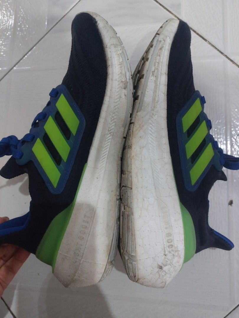 Adidas Ultraboost Running Shoes (Category: Babies & Kids Fashion) located in Baguio. Submitted by edenchiz12 (Listing ID 1438594997, Image 3). Description: - Adidas Ultraboost running shoes - Color: Navy blue with green accents - Features blue laces - White sole - Ultraboost logo on side and heel - Signs of wear on soles check last photo of the orig price mall/ store bought size: us uk 3.5J / fits eu 35.5 women for boy/girl/ petite women for walk