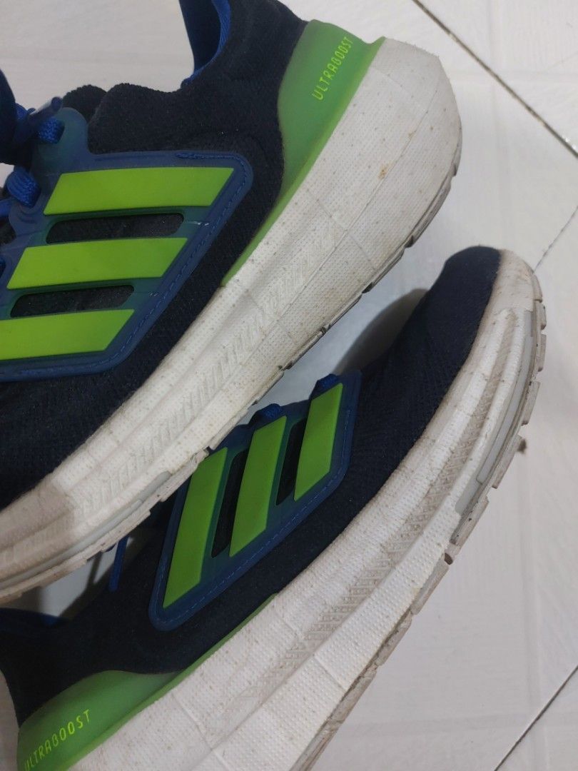 Adidas Ultraboost Running Shoes (Category: Babies & Kids Fashion) located in Baguio. Submitted by edenchiz12 (Listing ID 1438594997, Image 2). Description: - Adidas Ultraboost running shoes - Color: Navy blue with green accents - Features blue laces - White sole - Ultraboost logo on side and heel - Signs of wear on soles check last photo of the orig price mall/ store bought size: us uk 3.5J / fits eu 35.5 women for boy/girl/ petite women for walk