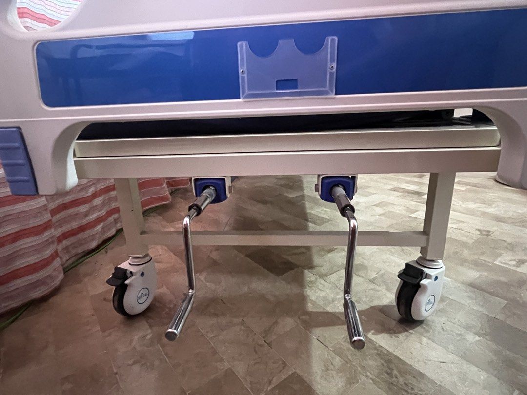 Adjustable Hospital Bed with IV Stand (Category: Medical Supplies & Tools) located in Consolacion. Submitted by claustings (Listing ID 1438658659, Image 3). Description: - Adjustable hospital bed - Includes comfortable mattress and integrated IV stand - Adjustable height and backrest via cranks - Equipped with wheels for easy mobility - Sturdy frame, well-maintained condition - Ideal for home or clinical settings - Slightly nego!! no to lowballer