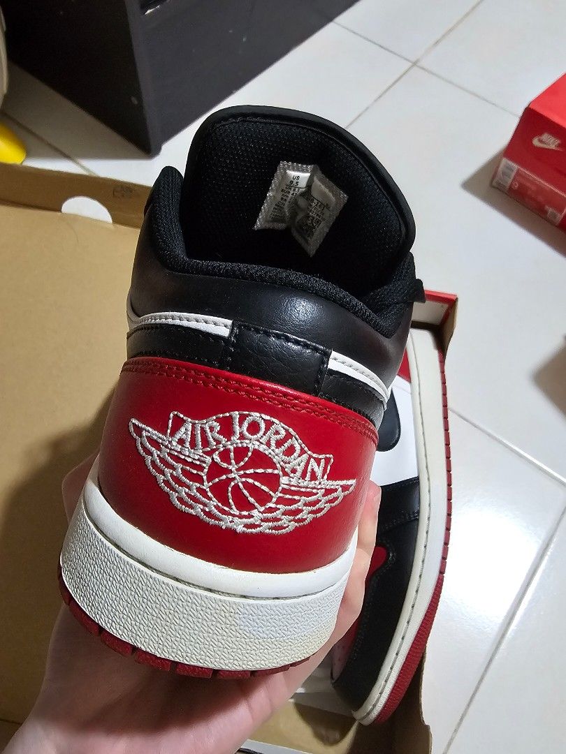 Air Jordan 1 Low - Black/White/Red (Category: Sneakers) located in Pasig City. Submitted by mon_08 (Listing ID 1438562815, Image 3). Description: - Air Jordan 1 Low sneakers - Classic black, white, and red colorway - Size: US 9.5 - Comes with original box - Black laces - NEGOTIABLE .