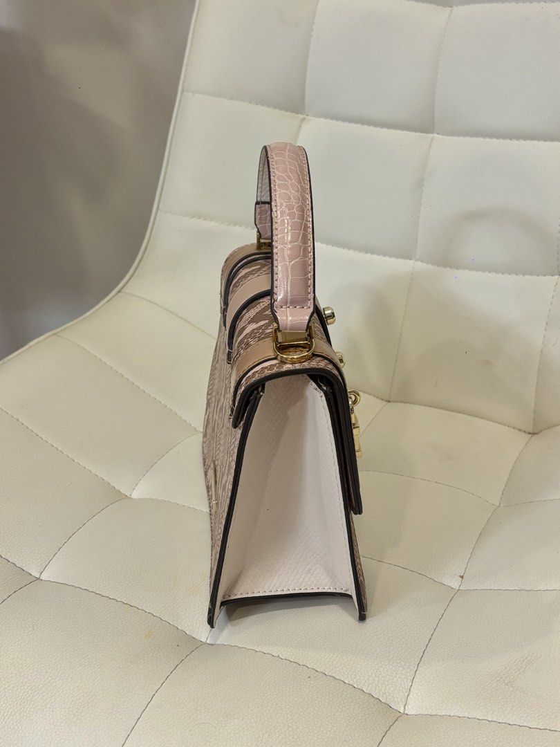 Aldo Snake Print Handbag (Category: Luxury Bags & Wallets) located in Andop. Submitted by pinkmatcha0715 (Listing ID 1438646258, Image 2). Description: - Aldo snake print handbag - Top handle and detachable shoulder strap - Secure lock closure - Multiple compartments - Color: Beige, pink, and white Location: Davao City .