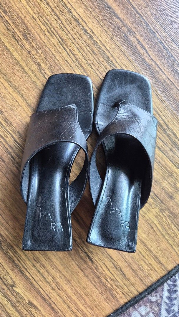 Apara Asymmetrical Wedge Heels in Black 40 (Category: Flats & Sandals) located in Manila. Submitted by layovertomarj (Listing ID 1438535338, Image 3). Description: - Black leather thong sandals - Size 40 - Square toe design - Brand visible on insole - Stylish and versatile Bought this for PHP 6,200. Selling for PHP3,000. Shipping included in the price. I can ship same-day if within Metro Manila. RFS: Decluttering.