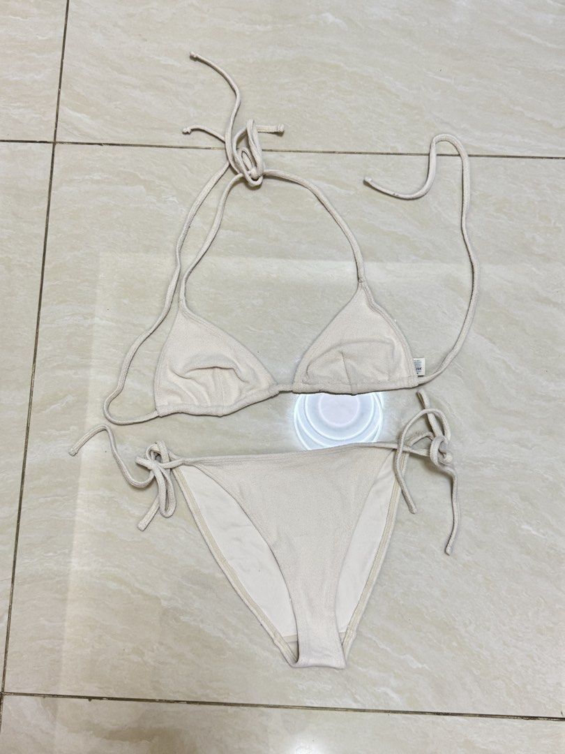 ARKET Bikini Set - EUR 34 (Category: Bikinis & Swimsuits) located in Paranaque City. Submitted by panmakes (Listing ID 1438640442, Image 1). Description: - ARKET Bikini Set - Size: EUR 34 - Style: Two-piece (triangle top & tie-side bottoms) - Color: Light beige - Made in China - Product ID: 1075406-001 - Production Date: 22/01/04.