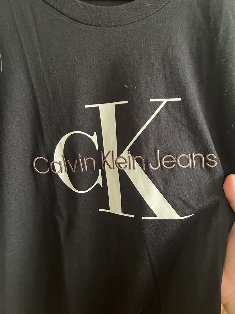 (Authentic) Calvin Klein CK Embroidered Shirt (Category: Tshirts & Polo Shirts ) located in Cavite. Submitted by kumbin (Listing ID 1438555358, Image 3). Description: Calvin Klein Shirt (100% legit) Store bought for almost 3k Dimensions: 22 by 29 inches (XL on tag) Issue: None. Brand new condition Condition: 10/10 excellent to new +sf Shipping via J&T.
