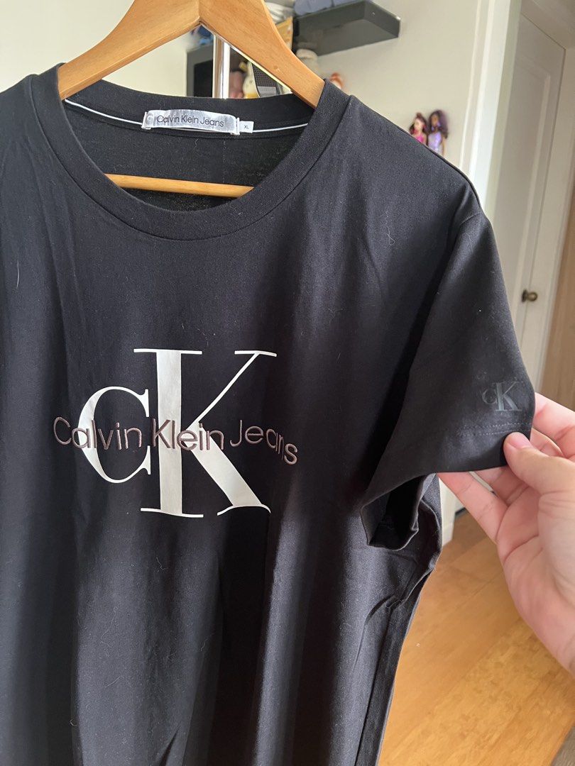 (Authentic) Calvin Klein CK Embroidered Shirt (Category: Tshirts & Polo Shirts ) located in Cavite. Submitted by kumbin (Listing ID 1438555358, Image 2). Description: Calvin Klein Shirt (100% legit) Store bought for almost 3k Dimensions: 22 by 29 inches (XL on tag) Issue: None. Brand new condition Condition: 10/10 excellent to new +sf Shipping via J&T.