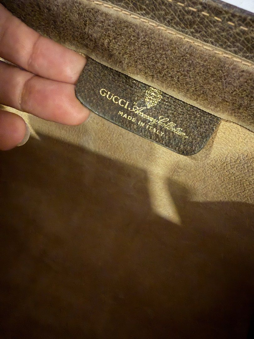Authentic Gucci Ophidia Clutch (Category: Luxury Bags & Wallets) located in Binan City. Submitted by brandlistbyj (Listing ID 1438641758, Image 2). Description: - Authentic Gucci clutch - Iconic GG Supreme canvas - Signature green and red stripe - Brown leather trim - Flap closure - Interior label: "Gucci Accessory Collection Made in Italy" - Vintage piece.