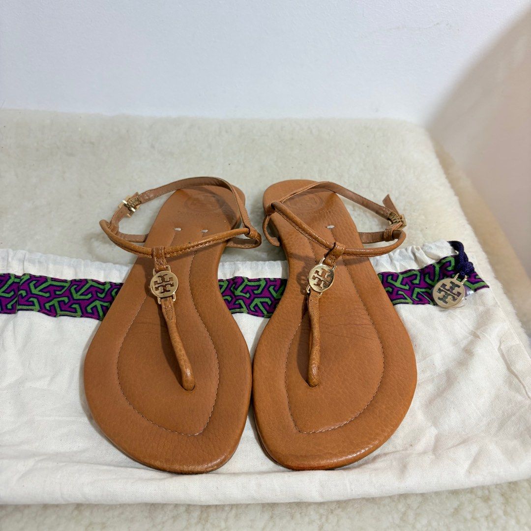 Authentic Tory Burch Emmy flat thong sandals in tan (Category: Flats & Sandals) located in Binangonan. Submitted by makoleksyon (Listing ID 1438584916, Image 1). Description: Excellent condition Like new No flaws Comes with dust bag Size US 8 Bought in Japan 💯% Authentic Money back guarantee .