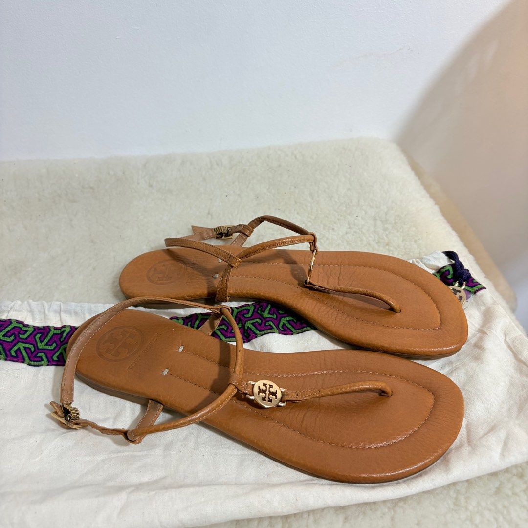 Authentic Tory Burch Emmy flat thong sandals in tan (Category: Flats & Sandals) located in Binangonan. Submitted by makoleksyon (Listing ID 1438584916, Image 2). Description: Excellent condition Like new No flaws Comes with dust bag Size US 8 Bought in Japan 💯% Authentic Money back guarantee .