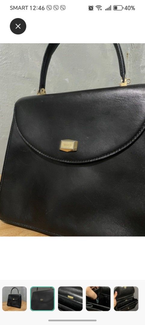 Bally Black Handbag (Category: Luxury Bags & Wallets) located in Makati City. Submitted by brooklyn87370 (Listing ID 1438540333, Image 3). Description: - Bally black handbag - Top handle design - Features a flap closure - Gold-toned logo detail - Interior zipper pocket - Crafted from leather - A classic and versatile accessory.
