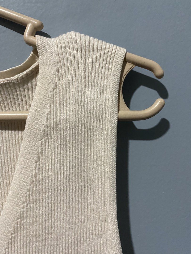 Bershka Ribbed Knit Top (Category: Sleeveless) located in Mandaluyong City. Submitted by _adjh (Listing ID 1438682005, Image 3). Description: - Bershka ribbed knit top - Neutral color - Size: L - Sleeveless - V-neckline - Button-down front .
