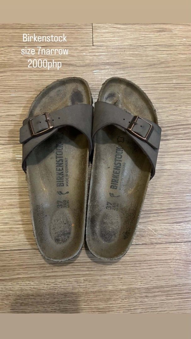 Birkenstock Sandals Size 37 Narrow (Category: Flats & Sandals) located in Taguig. Submitted by andrenalin (Listing ID 1438677654, Image 1). Description: - Birkenstock sandals - Size: 37 Narrow - Color: Brown - Material: Leather strap - Closure: Buckle - Condition: Footbed shows wear - Origin: Made in Germany.