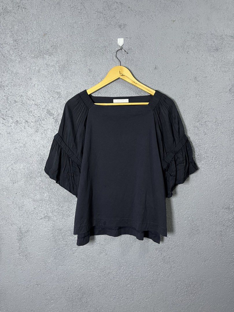 Black Top with Ruffle Sleeves - XL (Category: Blouses) located in Famy. Submitted by basicthrifted (Listing ID 1438651871, Image 1). Description: - Black top - Square neckline - Ruffle sleeves - Size: XL - Fabric: 51% polyester, 45% rayon, 4% polyurethane - Made in China.