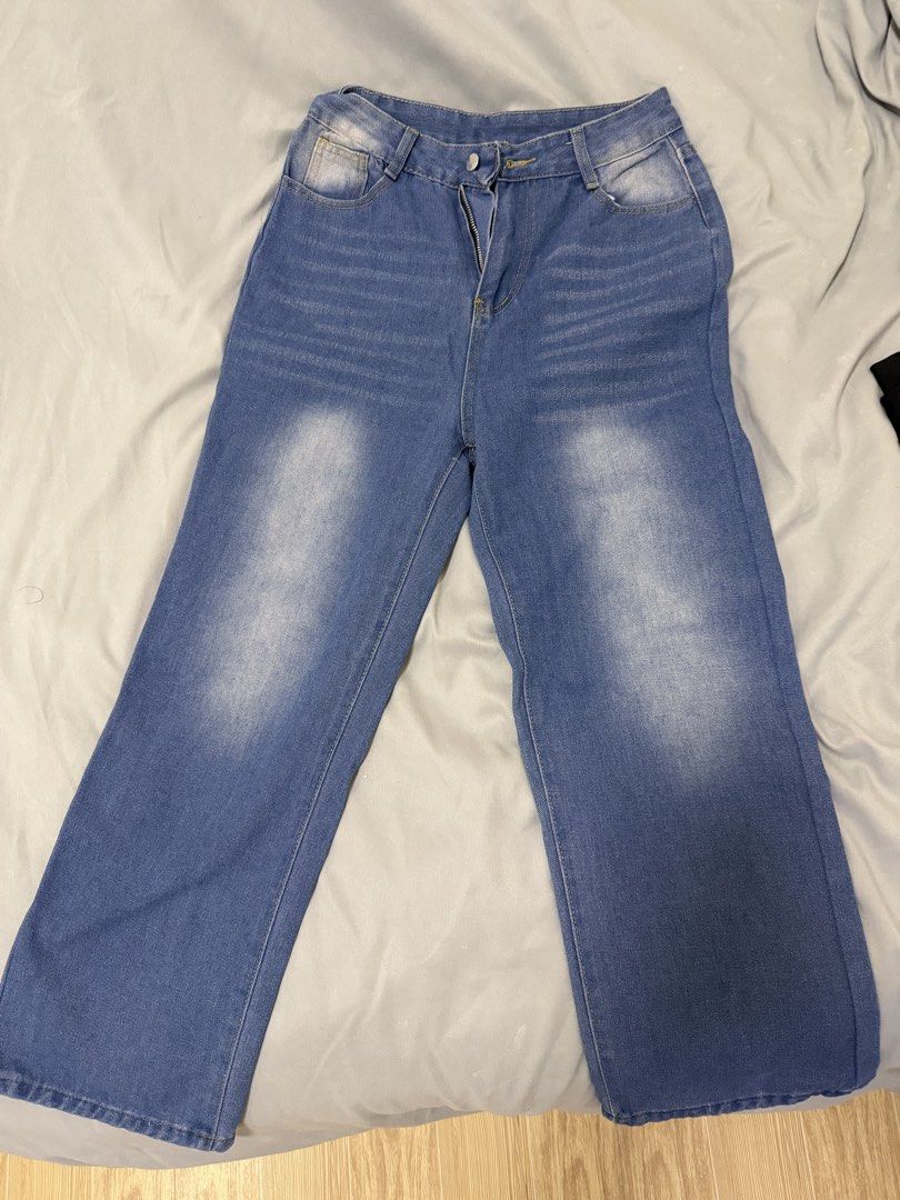 Blue Denim Wide Leg Jeans (Category: Jeans) located in Bulacan. Submitted by issajimm83879 (Listing ID 1438543250, Image 1). Description: - Blue denim wide-leg jeans - Button and zipper closure - Light wash effect on front - Classic five-pocket design.
