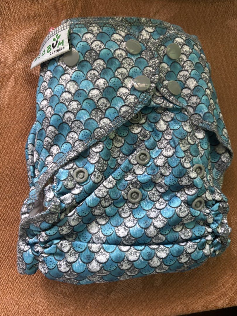 Bnew Cloth Diapers EcoBum and White Snaps (Category: Diapers & Baby Wipes) located in Antipolo. Submitted by seylecious (Listing ID 1438526884, Image 2). Description: - pack of 3 bnew cloth diaper set - Includes 2 inserts and various designs: - Blue and white scale pattern - Blue and green earth pattern - Blue stripes white pattern - Snap closures for easy adjustment - Diapers are in good, ready-to-use condition .