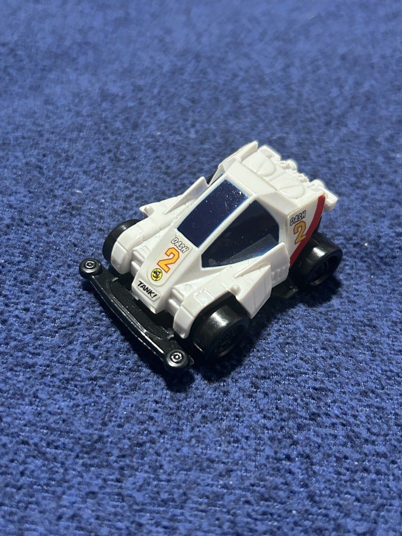 Bo36 Tamiya Dash-2 Burning Sun Mini 4WD car (Category: Vehicle & Diecast Models) located in Angeles City. Submitted by zyeplustradings (Listing ID 1438689372, Image 1). Description: Tamiya Dash-2 Burning Sun Mini 4WD car Model: Tamiya Dash-2 Burning Sun. Version: “White Special” promotional pull-back car. Campaign: DyDo Blend x Dash! Yonkuro collaboration.Features: Friction motor (pull-back) that allows the car to perform wheelies..