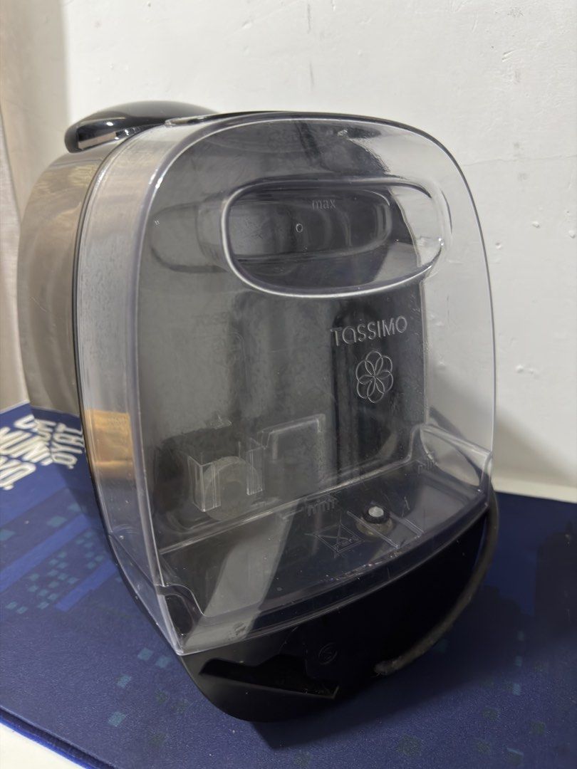 Bosch Tassimo Coffee Machine (Category: Coffee Machines & Makers) located in Trece Martires City. Submitted by raresen26 (Listing ID 1438585649, Image 3). Description: - Black Bosch Tassimo coffee machine - Includes water tank and manual - Model: TAS 20xx - Features power button and Tassimo logo - Clear water tank with max fill line - good as new - with box and manual.