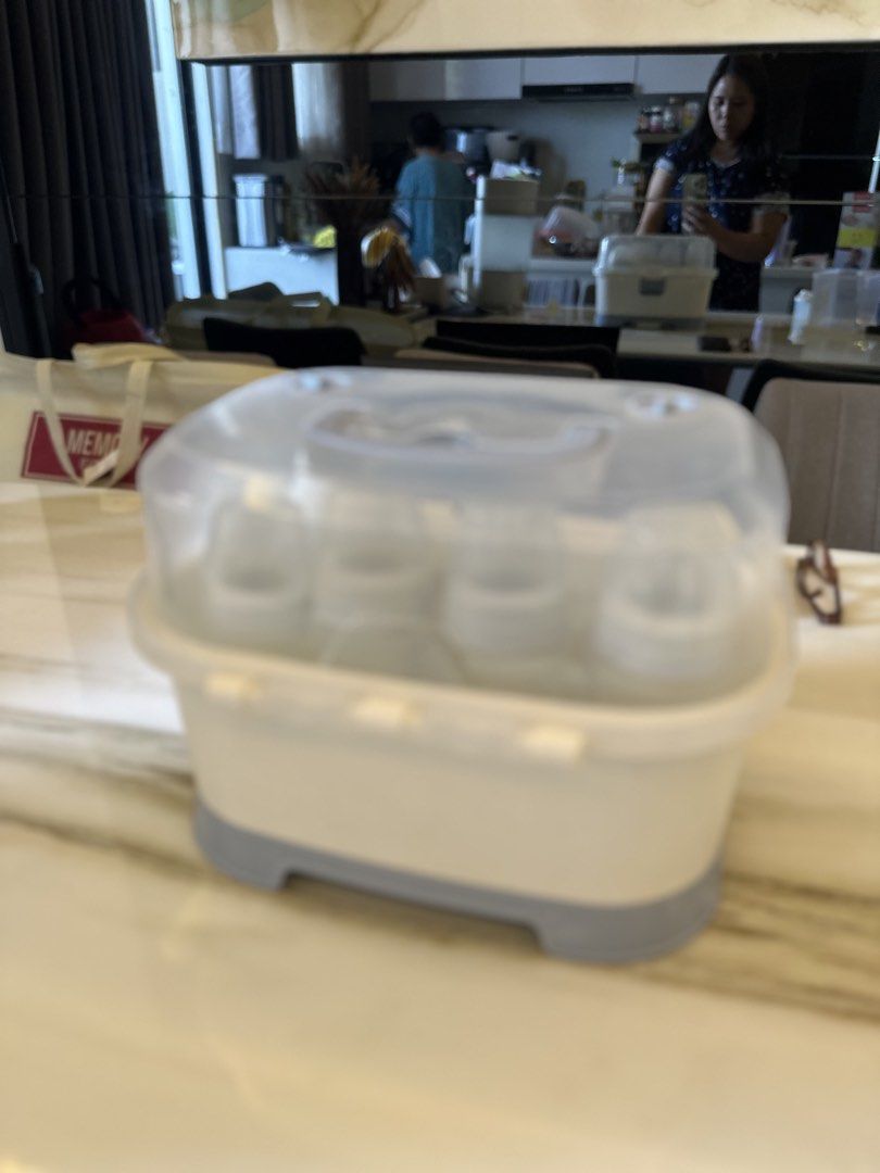 Bottles and storage box (Category: Breastfeeding & Bottle Feeding) located in Quezon City. Submitted by happysissies (Listing ID 1438515540, Image 3). Description: - Baby bottles and accessories. - Clear lid for easy viewing. - Features a secure latch. - Includes a tray for organized bottle placement. - Stylish white and gray design. - Easy to use and clean. -Negotiable!.
