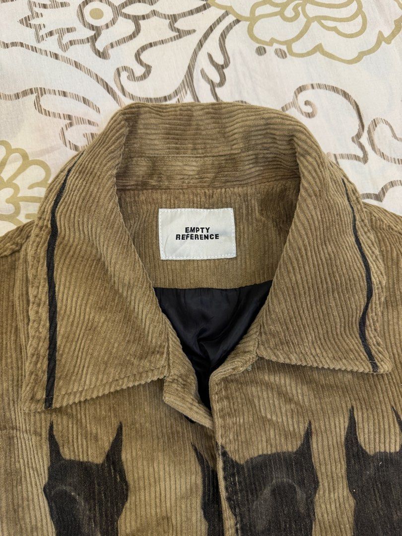 Brown Corduroy Doberman Jacket (Empty Reference) (Category: Coats, Jackets and Outerwear) located in Manila. Submitted by gronte (Listing ID 1438598273, Image 2). Description: Brown Corduroy Jacket with Doberman Print by Empty Reference •can nego price • bought online • never used • no visible flaws fits S-L 23x24 msg for more measurements/details/nego mop: gcash mod: jnt/lalamove (buyer shoulder shipping fees) loc: parañaque/alabang .