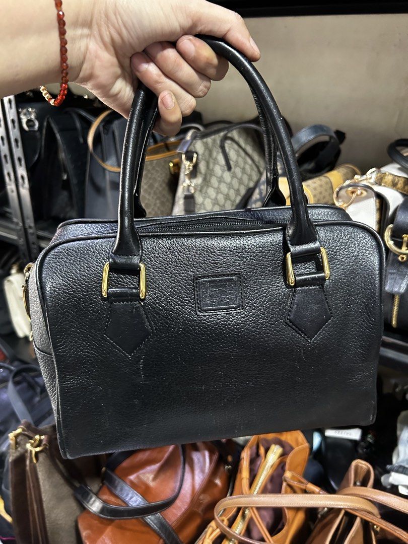 Burberry Black Leather Handbag (Category: Community) located in Manila. Submitted by starbalesukandjapansurplus (Listing ID 1438606197, Image 1). Description: - Black leather Burberry handbag - Top handles - Zip closure - Gold-tone hardware - Burberry logo detail - Classic, everyday style.