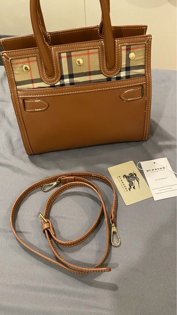 Burberry Mini Handbag with Shoulder Strap (Category: Luxury Bags & Wallets) located in Cavite. Submitted by fantastikpinay (Listing ID 1438631177, Image 1). Description: -decluttering -pre-owned -can send more pics sa dm -nego -mop gotyme/maribank/maya -mod jnt/lalamove or meetup within imus/bacoor RFS- need funds.