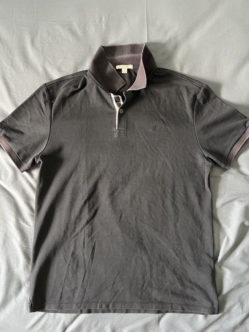Burberry Polo Shirt - XL (Category: Tshirts & Polo Shirts ) located in Manila. Submitted by puffsxbangs (Listing ID 1438558794, Image 1). Description: - Authentic Burberry polo shirt - Color: Black - Size: XL - Classic polo collar and short sleeves - Embroidered Burberry logo Issue: seen in pics W:21 inches L: 26 inches.