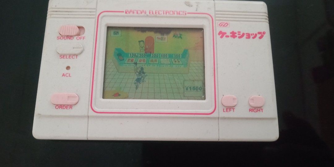 Cake shop bandai handheld electronic game WORKING (Category: Interactive Toys) located in Bulacan. Submitted by dyazpuzhpley021577r (Listing ID 1438527562, Image 3). Description: working medyo may dim lang ung lcd sa itaas Mop gcash ad sf open for llamove pick up thnks.