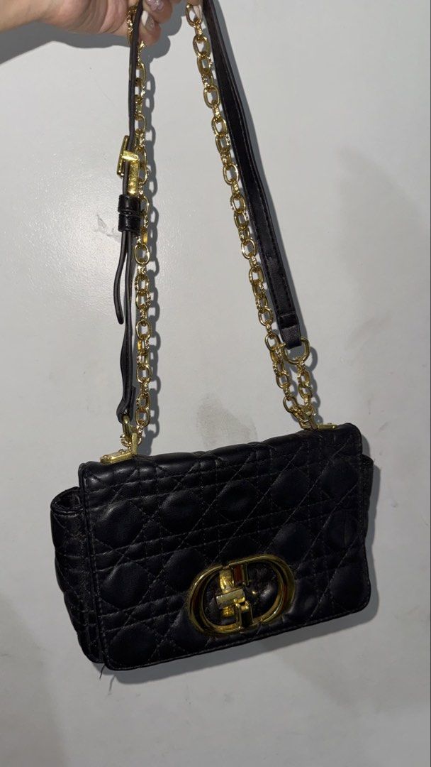 Christian Dior Black Quilted Shoulder Bag (Category: Luxury Bags & Wallets) located in Paranaque City. Submitted by caseycunanan (Listing ID 1438573039, Image 1). Description: - Black quilted shoulder bag - Gold-tone chain strap and hardware - Flap closure with gold-tone CD logo - Interior zippered pocket with Christian Dior label - Made of leather - Adjustable strap.